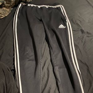 Black with white stripes adidas joggers . size Med